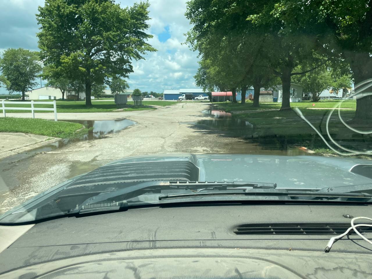 Finished rock driveway installation with weeping willow — Brohez Trucking LLC Central Illinois