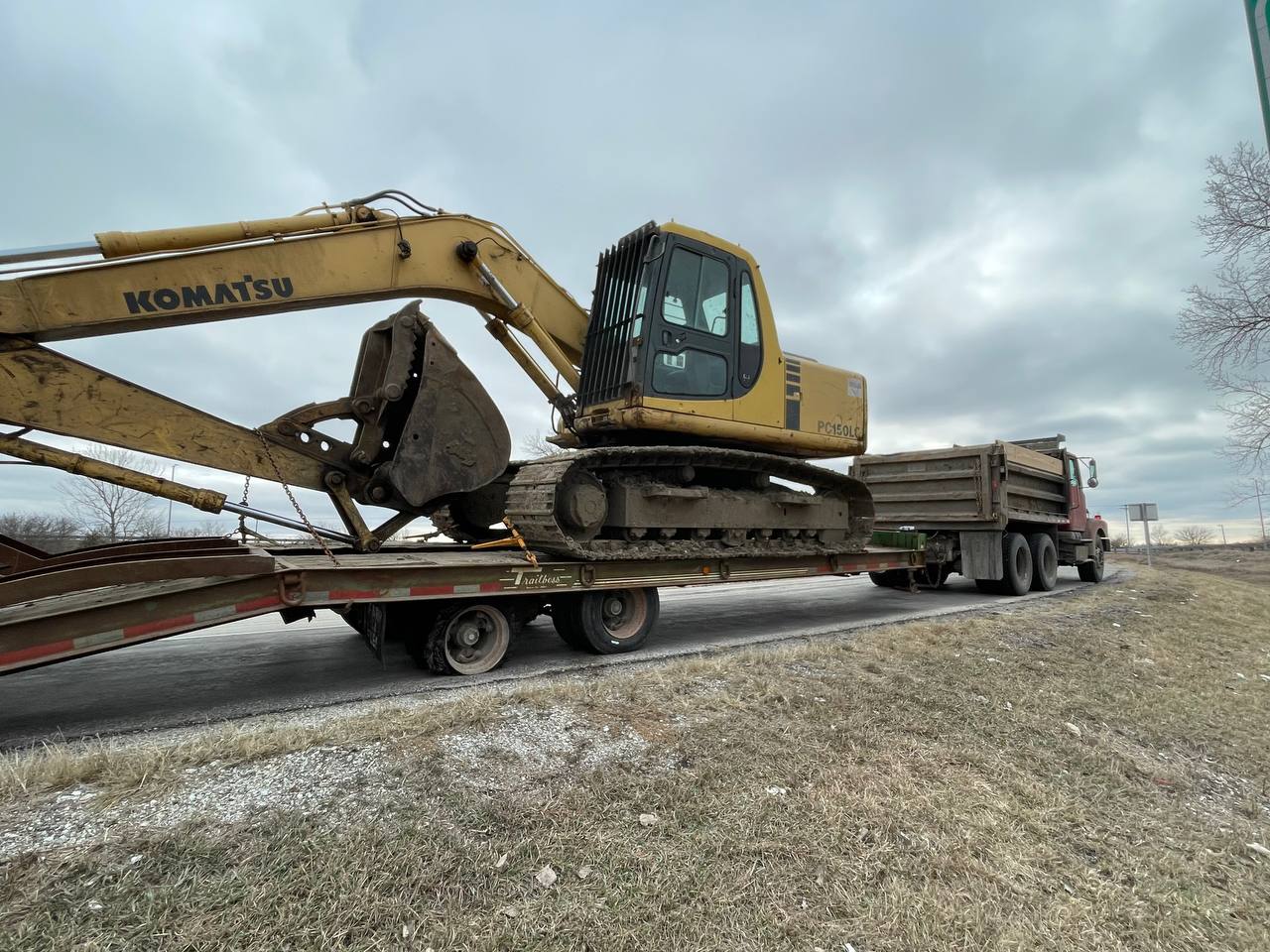 Komatsu excavator transported to job site in Mattoon IL — Brohez Trucking LLC